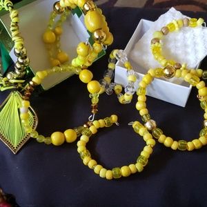 Beaded bracelets with gold bling.